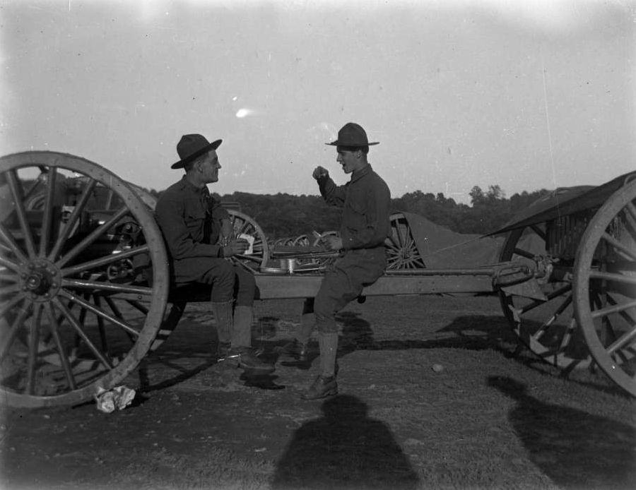 Two Soldiers Seated On A Caisson, Eating, Van Cortlandt Park, 1917.