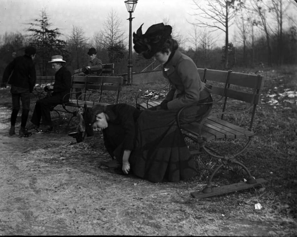 A Woman Helping Another Woman With Her Skates, Van Cortlandt Lake, Van Cortlandt Park, 1902.