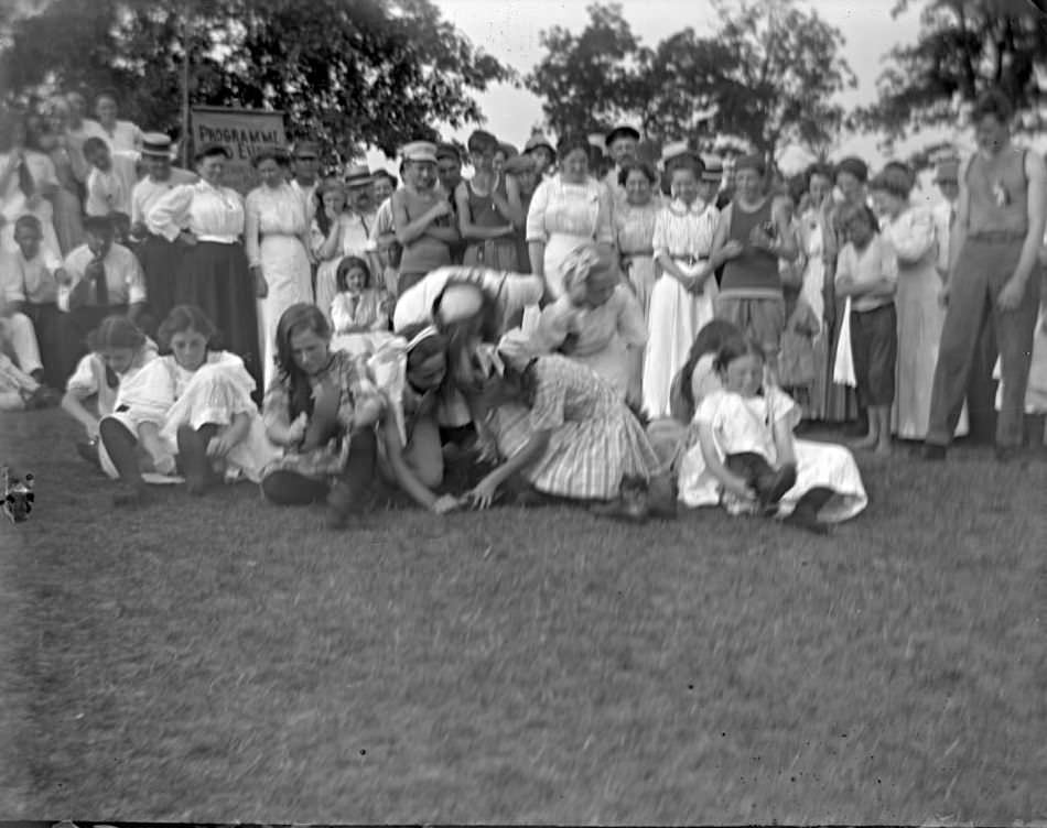 Girls Putting Shoes On For A Race At Orchard Beach, Bronx, 1909.