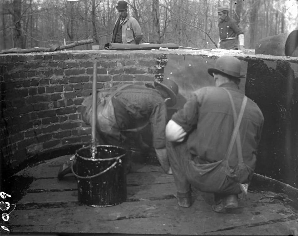 Workmen Waterproofing The Bear Pools With Paper And Hot Tar At The Bronx Zoo, Bronx, 1899.
