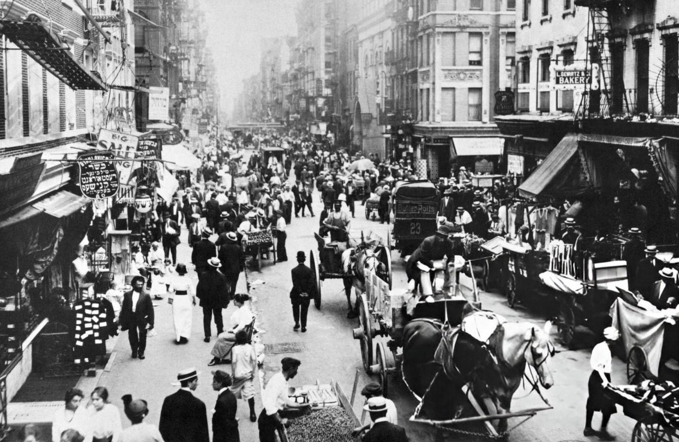 People, Peddlers, And Horse-Drawn Carriages On A Lower East Side Street, 1900.