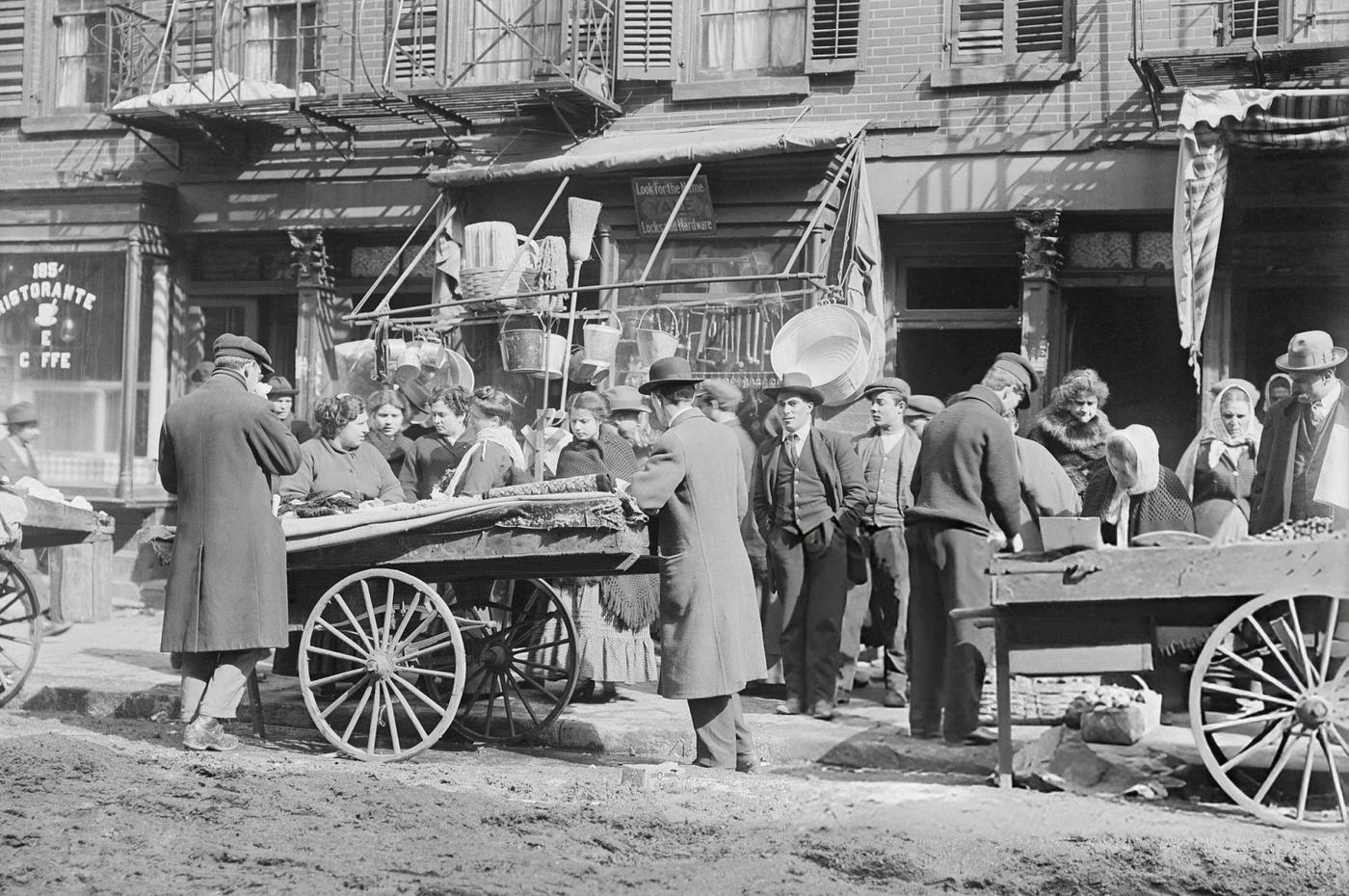 Vendors Selling Wares Out Of Their Pushcarts Along Hester Street.