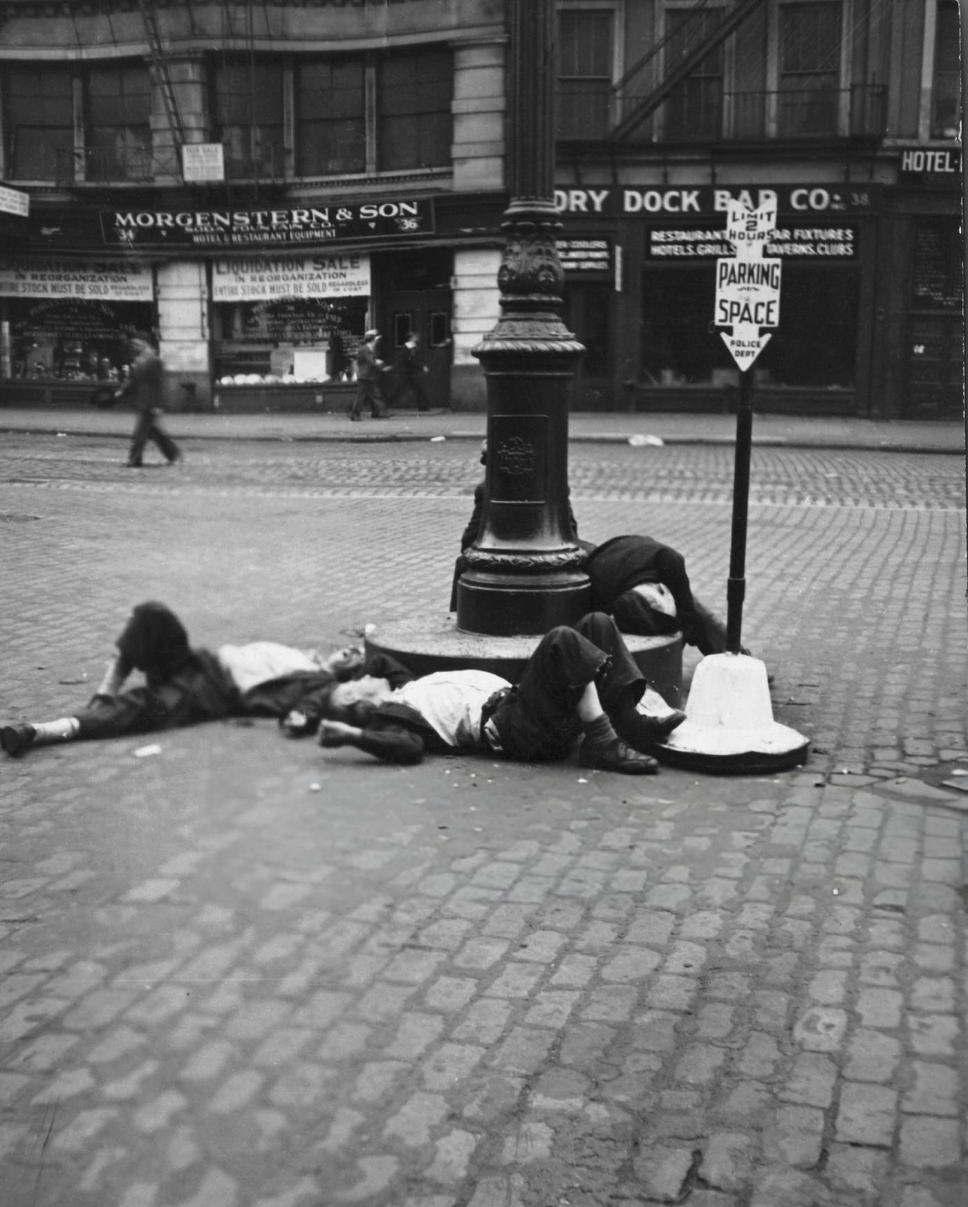 Three Bowery Drifters Lying In The Street.