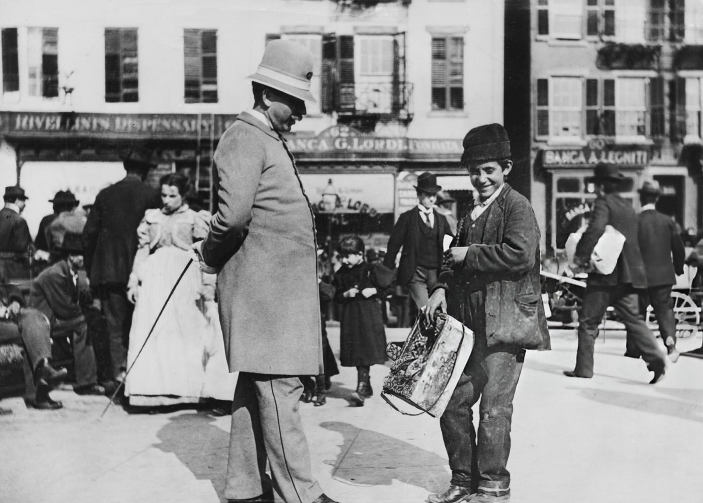 A Shoeshine Boy With A Policeman On Mulberry Street In Lower Manhattan, 1900.