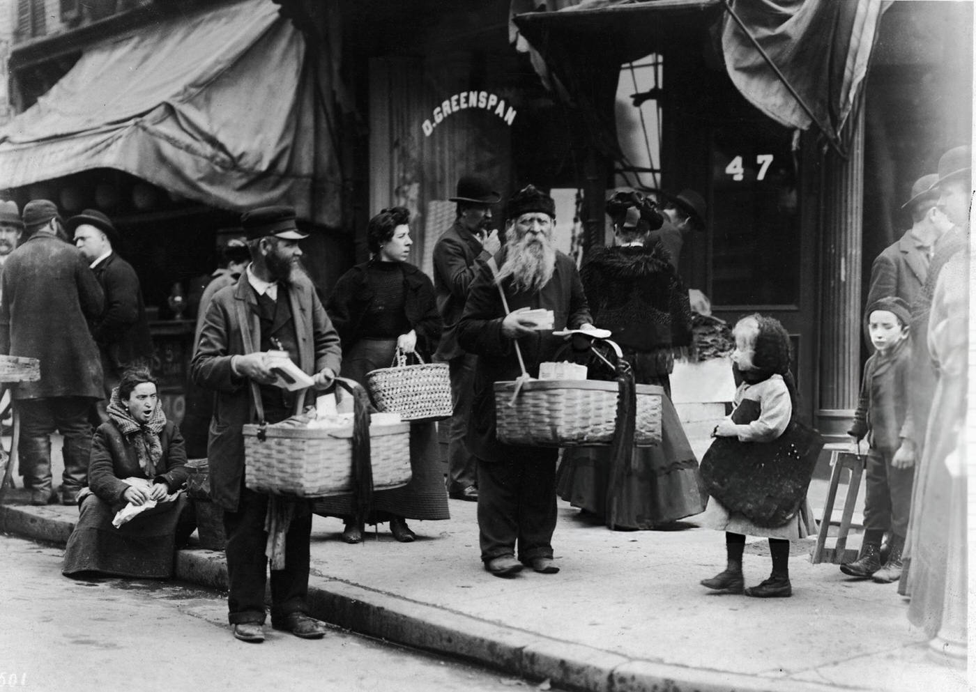 Street Vendors Carry Their Goods In Baskets On A Sidewalk On The Lower East Side, 1900S.