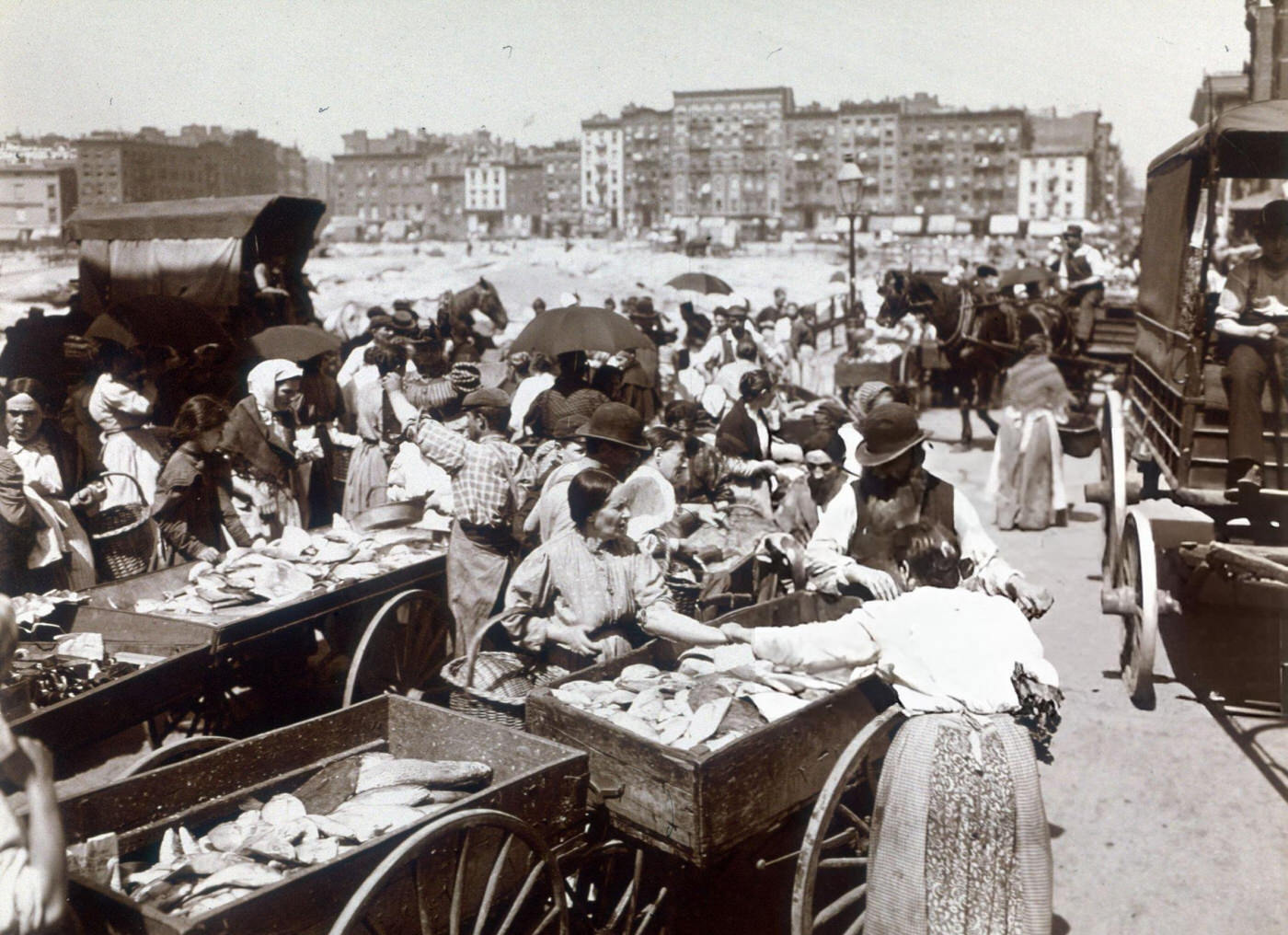 People Inspect Carts Filled With Fish At An Outdoor Market At The Intersection Of Hester Street And Suffolk Street On The Lower East Side, 1898.