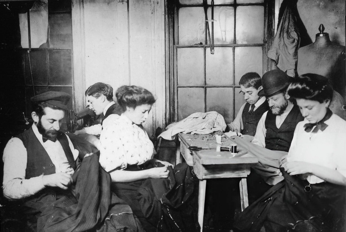 Men And Women Sew Clothes In A Lower East Side Sweatshop, 1910.