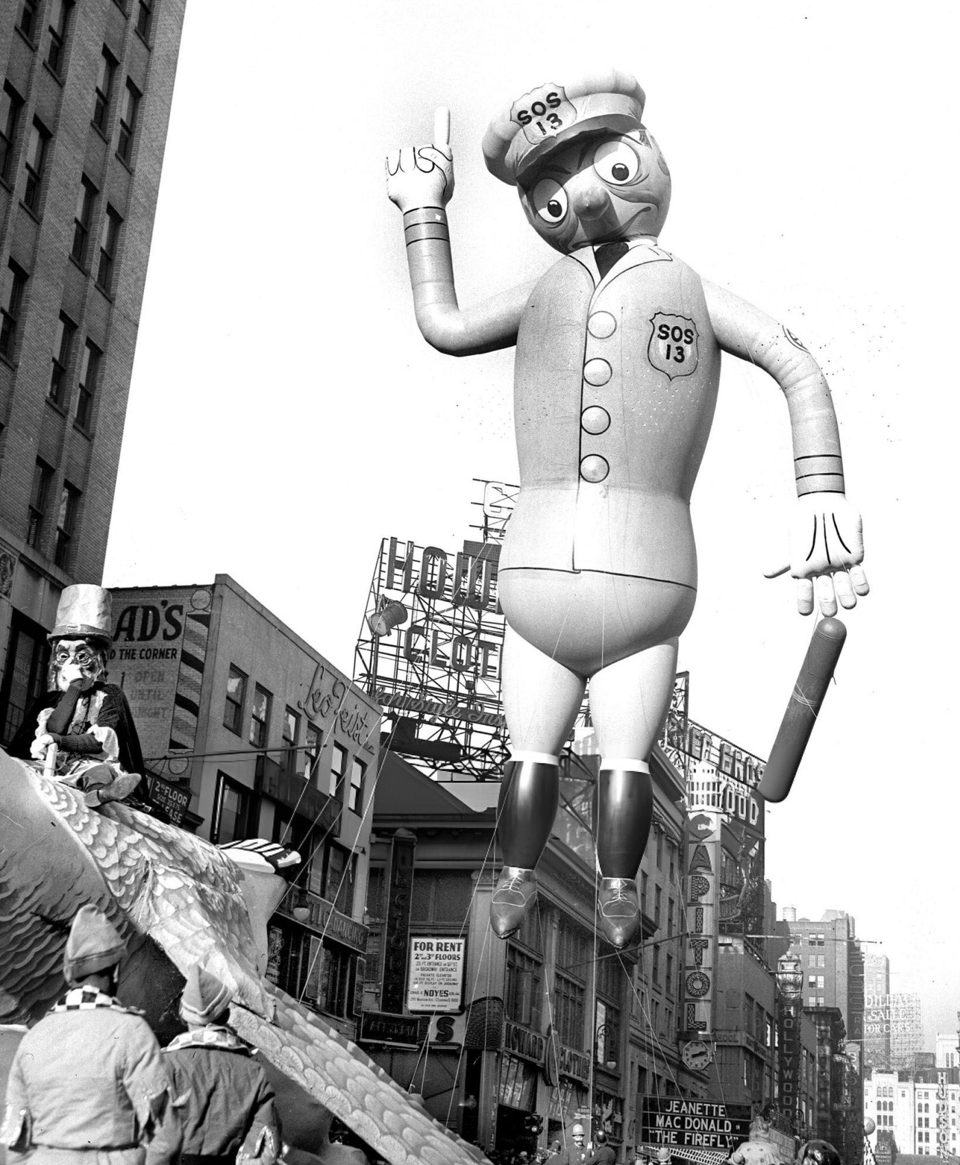 A Balloon In The Shape Of A Police Officer Floats Down Broadway During The Thirteenth Annual Macy'S Thanksgiving Day Parade, 1937.
