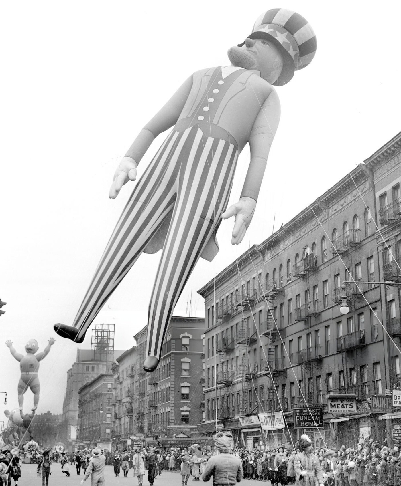 The Huge Uncle Sam Balloon, Seventy-Five Feet High, Comes Down Broadway At 106Th St. In Macy'S Thanksgiving Day Parade, 1938.
