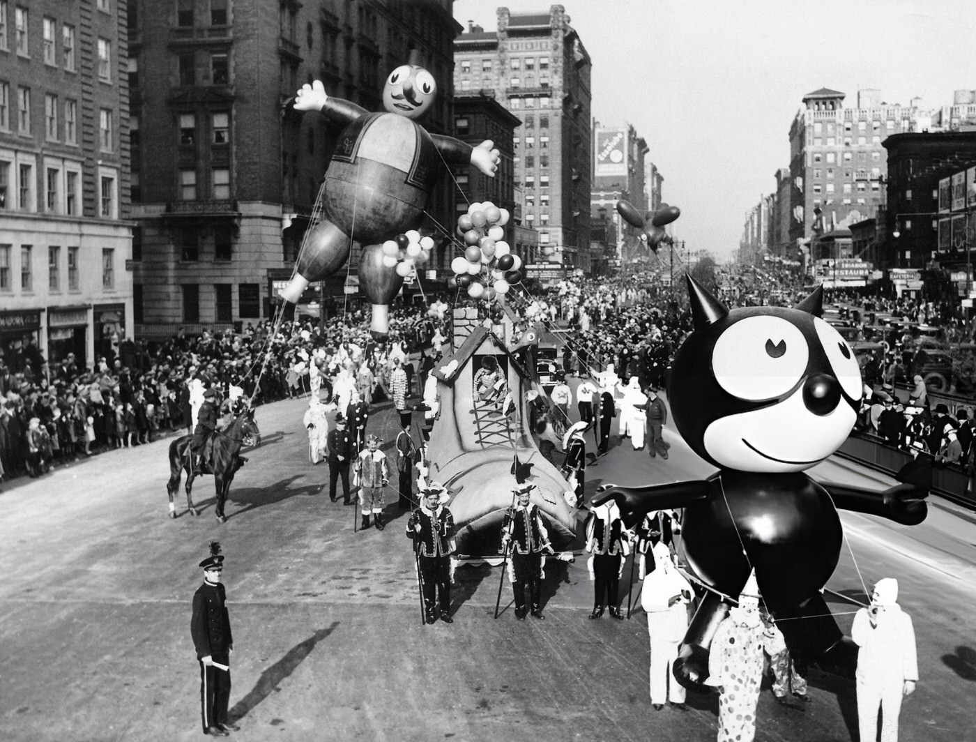 A Felix The Cat Balloon, Followed By Terrible Turk And Willie Red Bird Balloons, Is Led Down Broadway During The Annual Macy'S Thanksgiving Day Parade, 1932.
