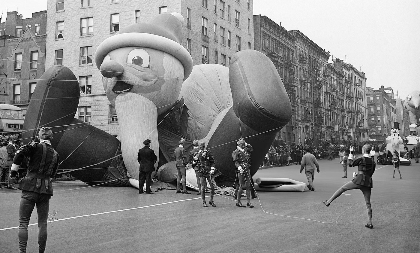 Parade Participants Hold Ropes Attached To The Santa Claus Parade Balloon As It Collapses During The Annual Macy'S Thanksgiving Day Parade In New York City, 1941.
