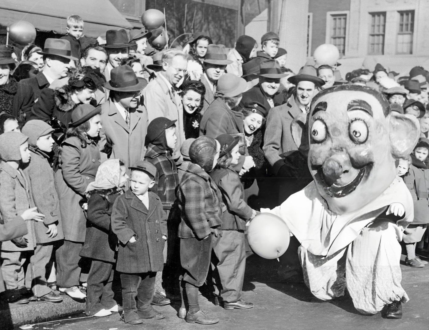 A Clown Stops To Shake Hands With Children During Macy'S Thanksgiving Day Parade, 1946.