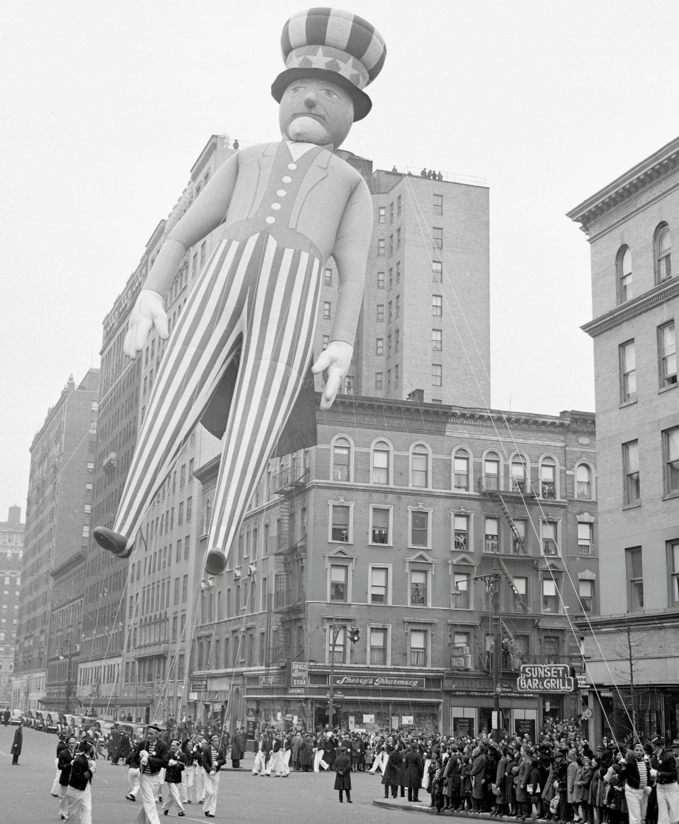 Mr. U.s.a., Complete With Rangy Legs And A Star-Spangled Hat, Moves Down The Street During Macy'S Thanksgiving Day Parade, 1940.