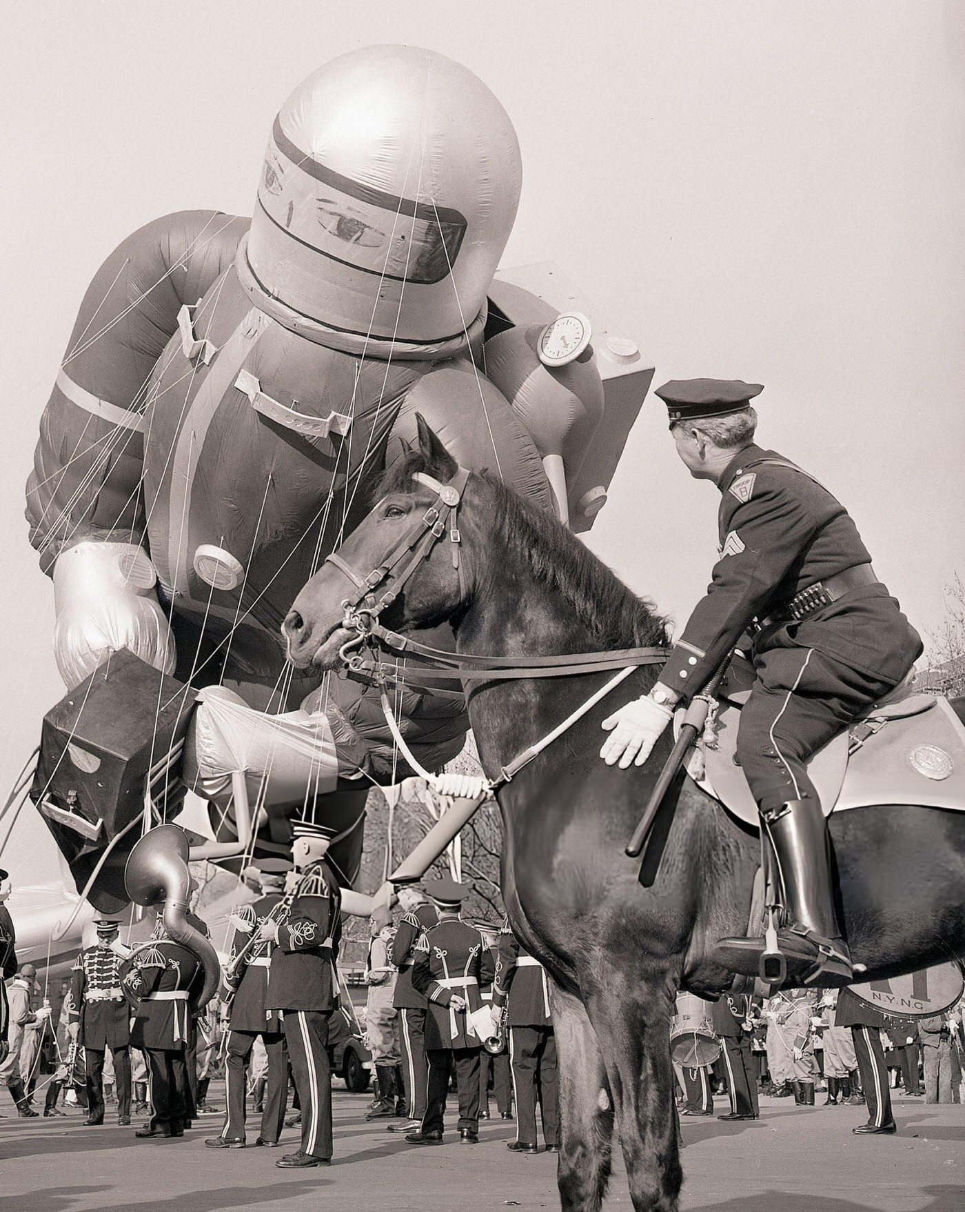 Sergeant Frank Ford Of New York City'S Mounted Police Steadies His Horse As The Mammoth &Amp;Quot;Space Cadet&Amp;Quot; In Macy'S Thanksgiving Day Parade Leans Threateningly, 1952.