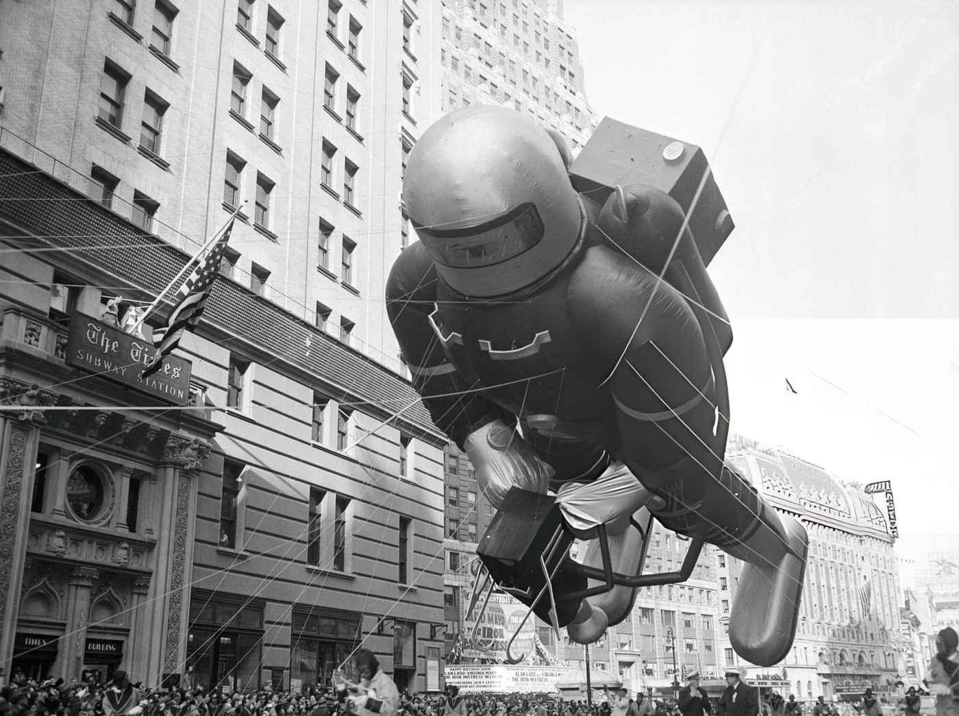 A Giant Spaceman Balloon Looms Over The Crowd Watching The Macy'S Thanksgiving Day Parade In New York City, 1952.