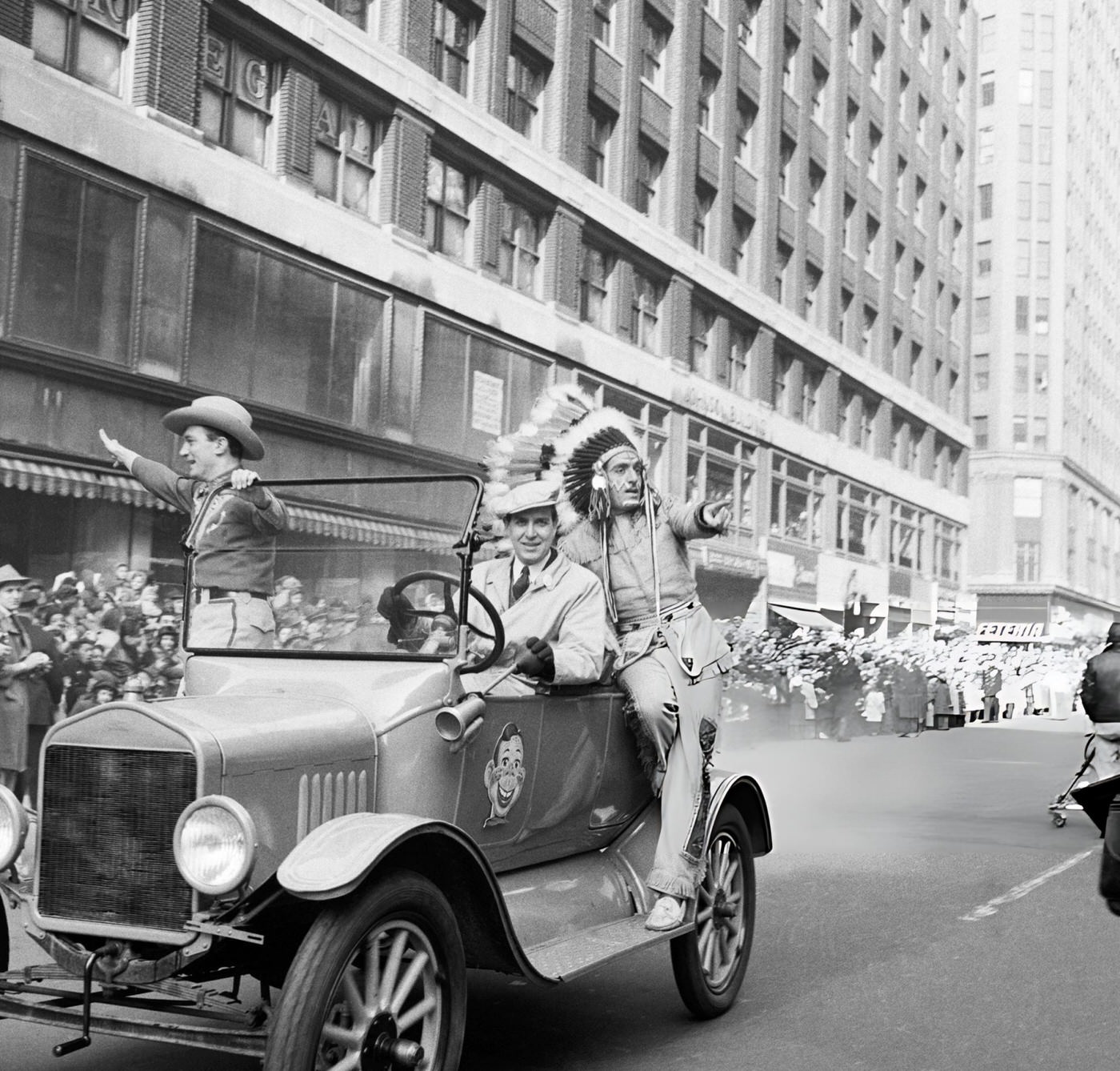 A Car Drives By With Howdy Doody Characters Bob Smith As Buffalo Bob Smith And Bill Lecornec As Chief Thunderthud During The 1954 Macy'S Thanksgiving Day Parade, 1954.