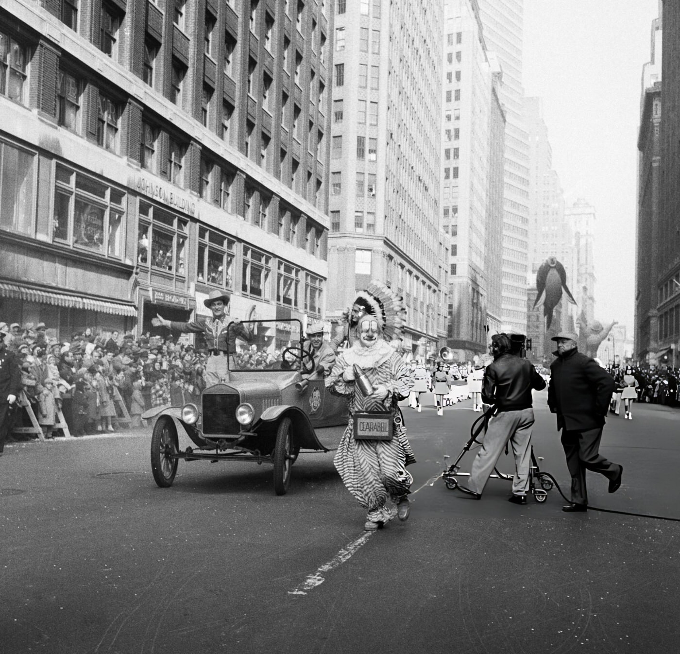 A Car Drives By With Howdy Doody Characters Bob Smith As Buffalo Bob Smith, Bill Lecornec As Chief Thunderthud, And Lew Anderson As Clarabell The Clown During The 1954 Macy'S Thanksgiving Day Parade, 1954.