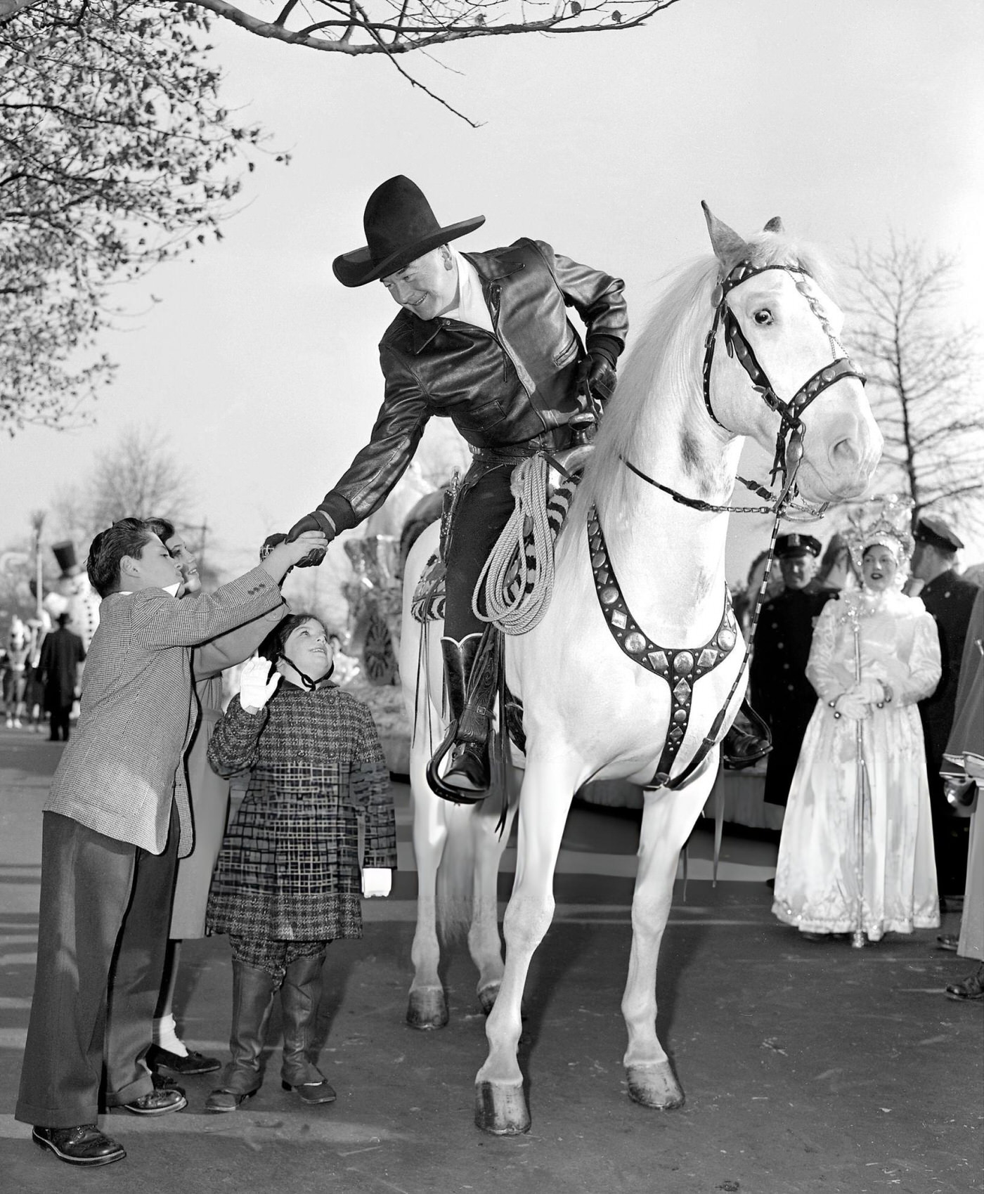 Children Are Impressed When Hopalong Cassidy (William Boyd) Obliges With A Handshake As He Rides Topper In Macy'S Thanksgiving Day Parade, 1951.
