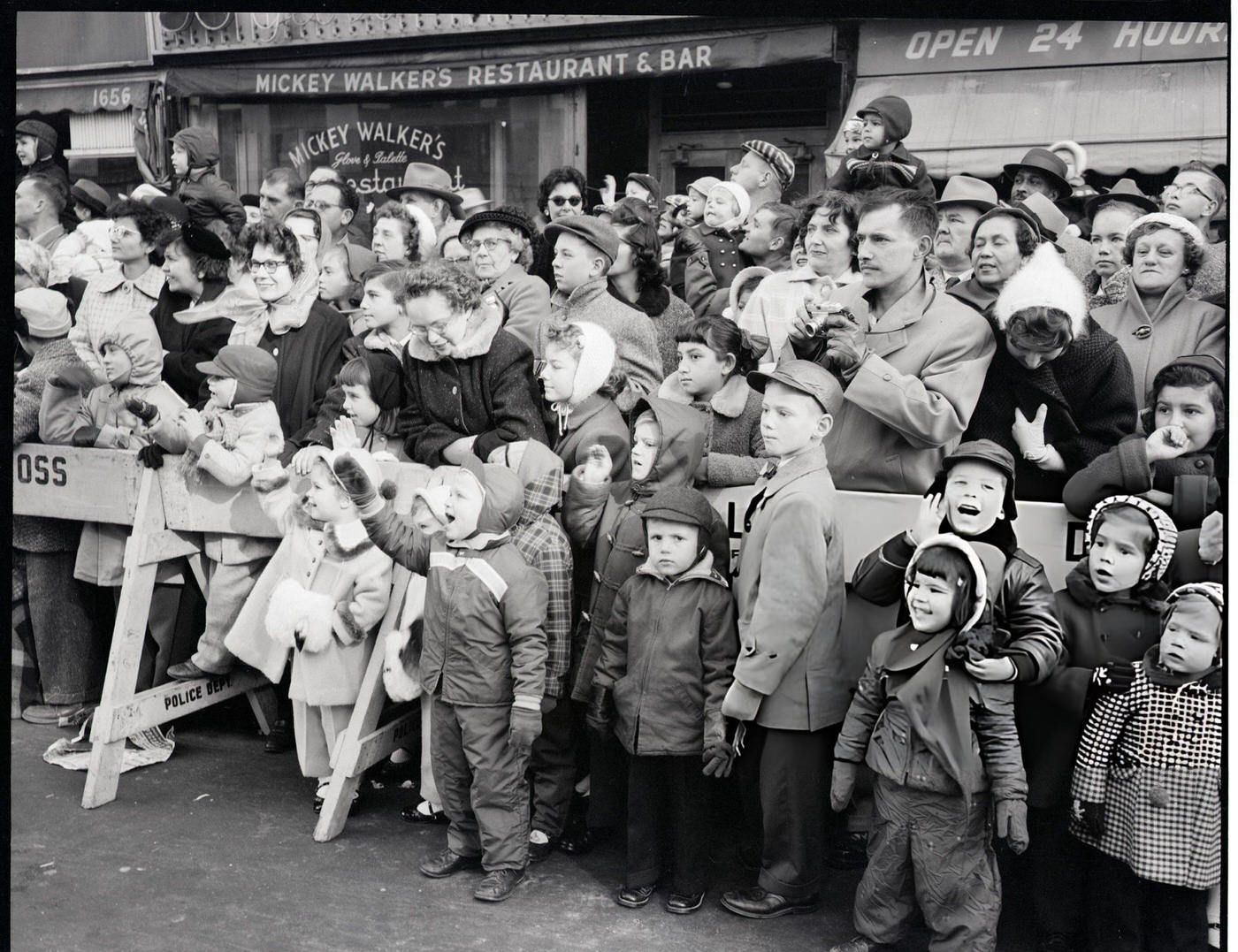 Crowds Watch Macy'S Thanksgiving Day Parade Behind A Police Barricade, 1956.