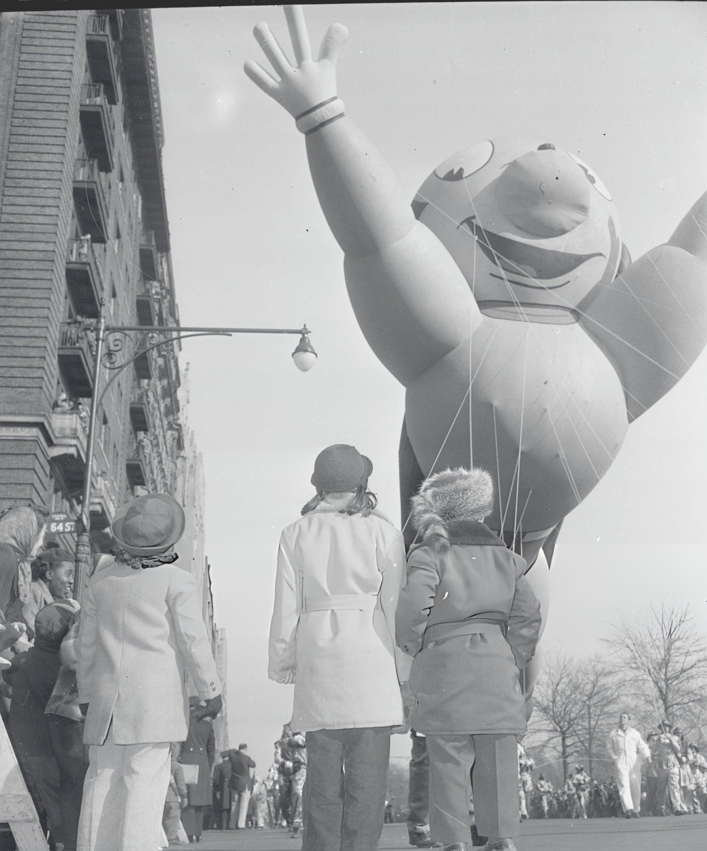 Children Look On As One Of The Big Balloons In The Macy Parade Passes Them, 1950S.