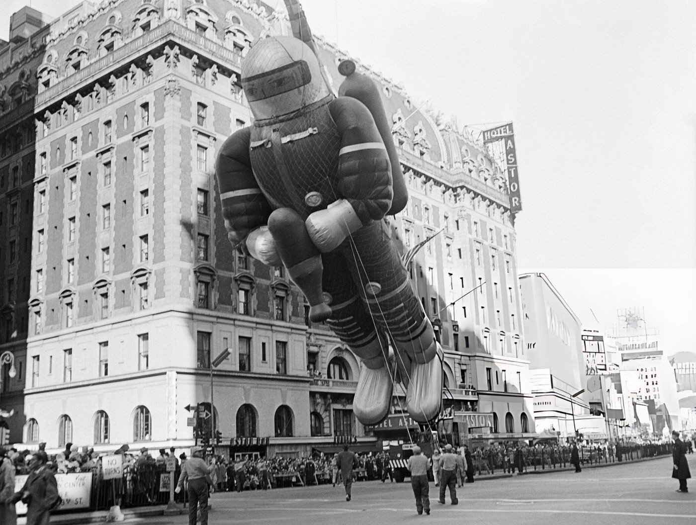 A Towering Spaceman Balloon, Held By A Crane, Receives Admiration At Macy'S Thanksgiving Parade, 1956.