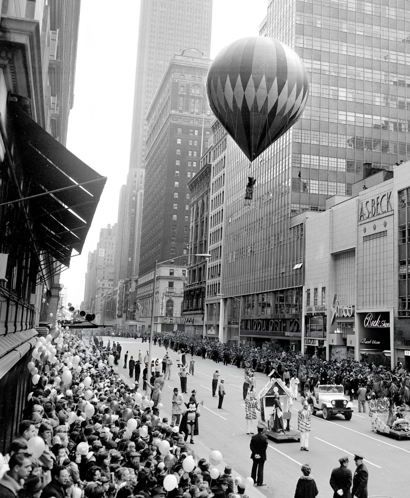 A Teddy Bear Dangles Gaily From A Balloon Floating Over The Crowd On 34Th Street During Macy'S Thanksgiving Day Parade, 1961.