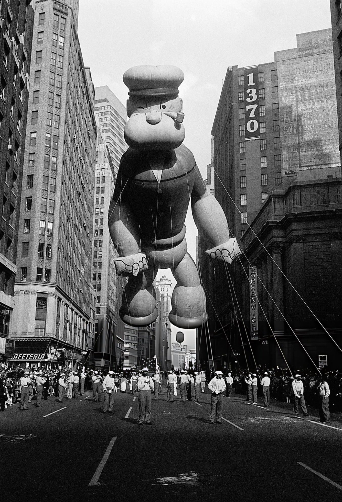 A Giant &Amp;Quot;Popeye&Amp;Quot; Balloon Floats Above The Street During The Annual Macy'S Thanksgiving Day Parade In New York, 1961.