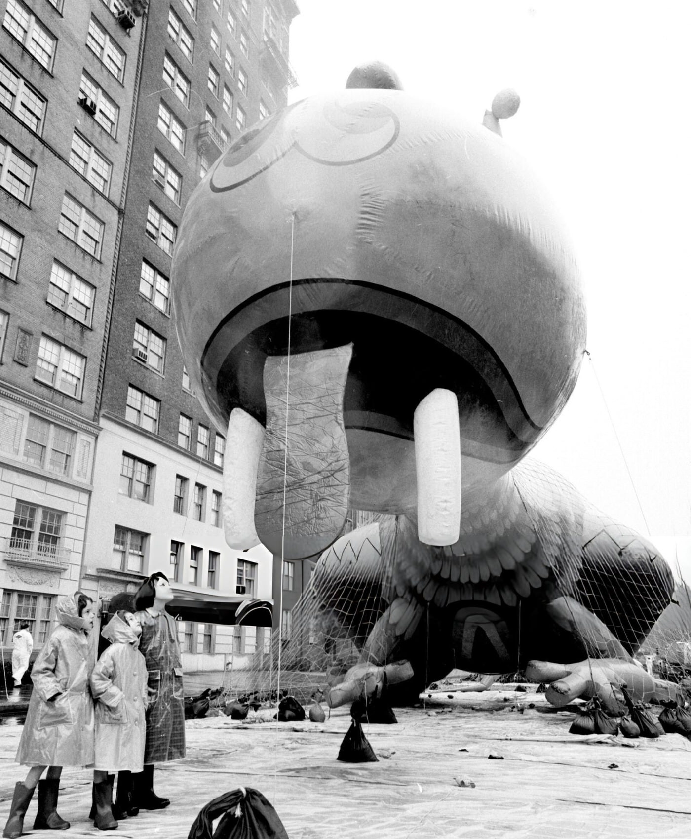 A &Amp;Quot;Tongue-Wagging&Amp;Quot; Dragon Float Is Admired By Girls At 77Th Street And Central Park West Before Macy'S Thanksgiving Day Parade, 1961.