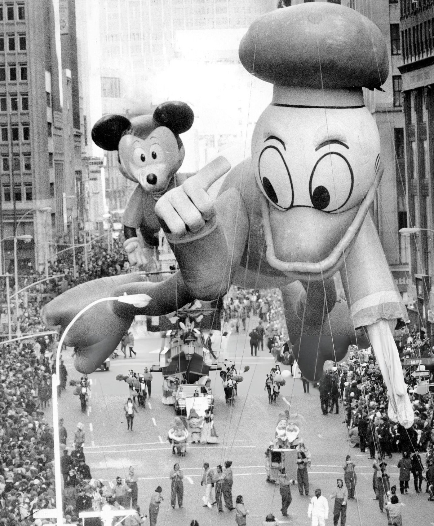 Donald Duck Sports A Limp Wing After A Brush With A Tree Branch At Macy'S Thanksgiving Day Parade, With Sidekick Mickey Mouse Marching Behind, 1972.