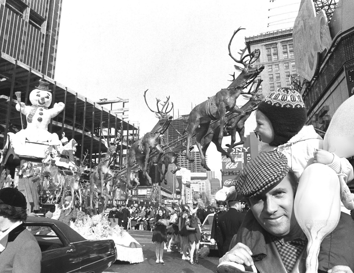 A Snowman, Eight Tiny Reindeer, And Other Figures Accompany Santa Claus As He Sails Through Macy'S Thanksgiving Day Parade In Times Square, 1970.