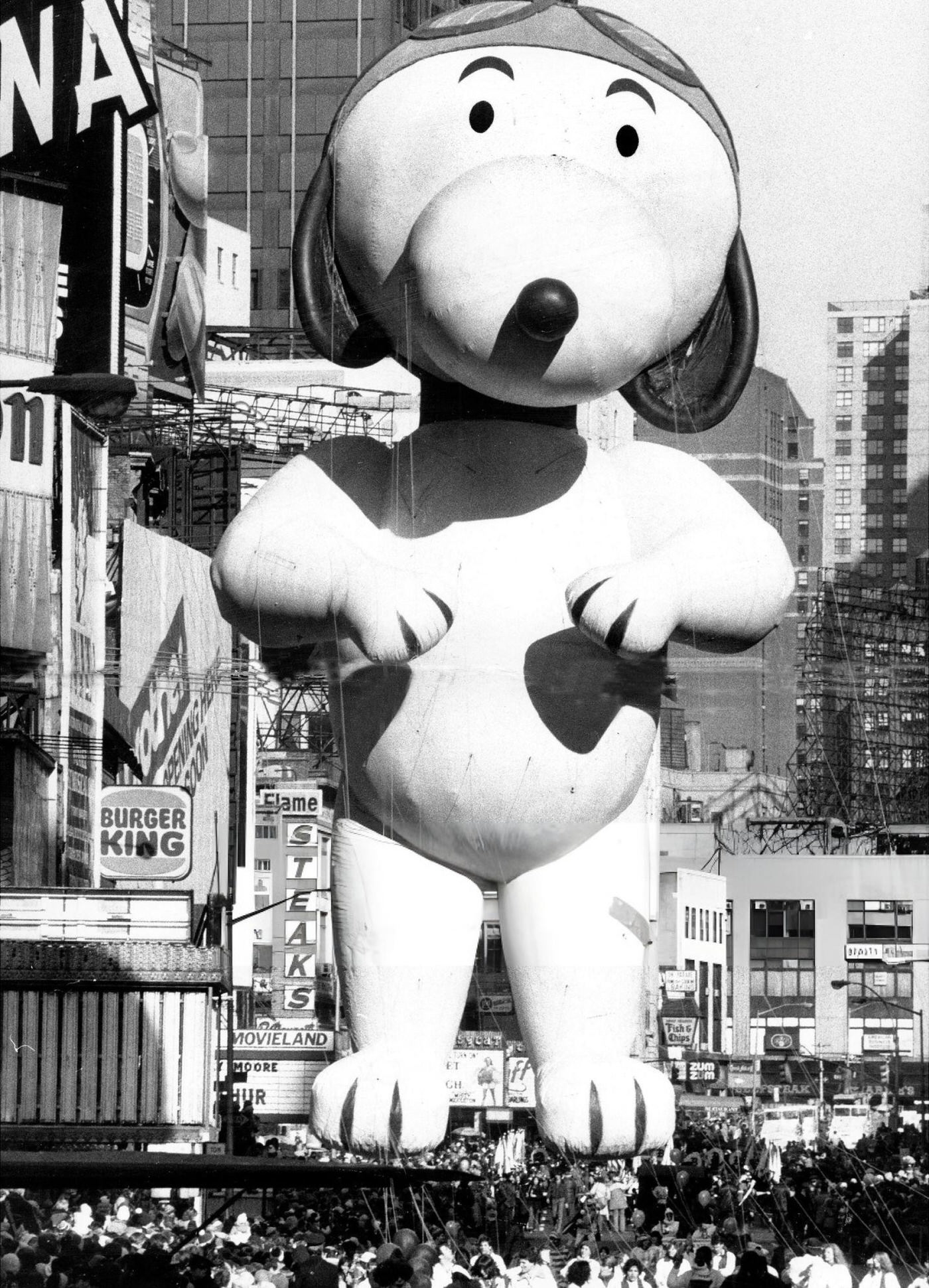 Snoopy, Who Missed The Previous Year'S Parade After An Encounter With The Red Baron, Flies Over The Crowd During The Macy'S Thanksgiving Day Parade.