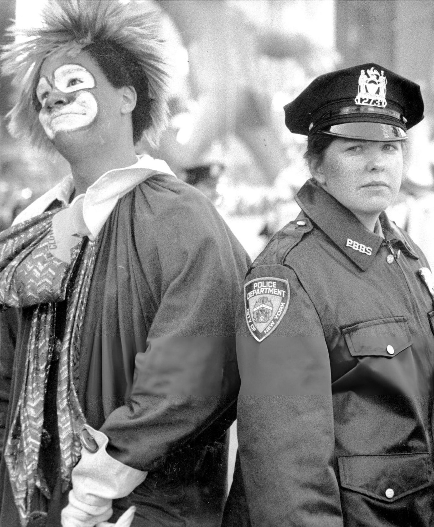 A Clown And A Police Officer Are Seen Together At The Macy'S Thanksgiving Day Parade.