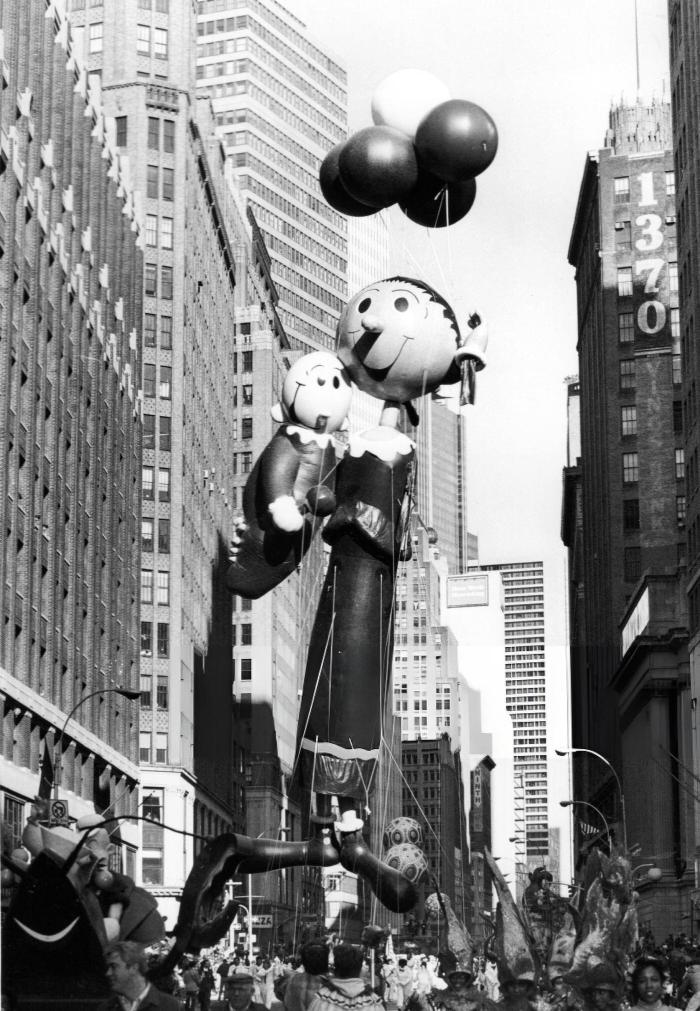 Olive Oyl And Sweet Pea Balloons Float Over The Street During The Macy'S Thanksgiving Day Parade, November 27, 1986.