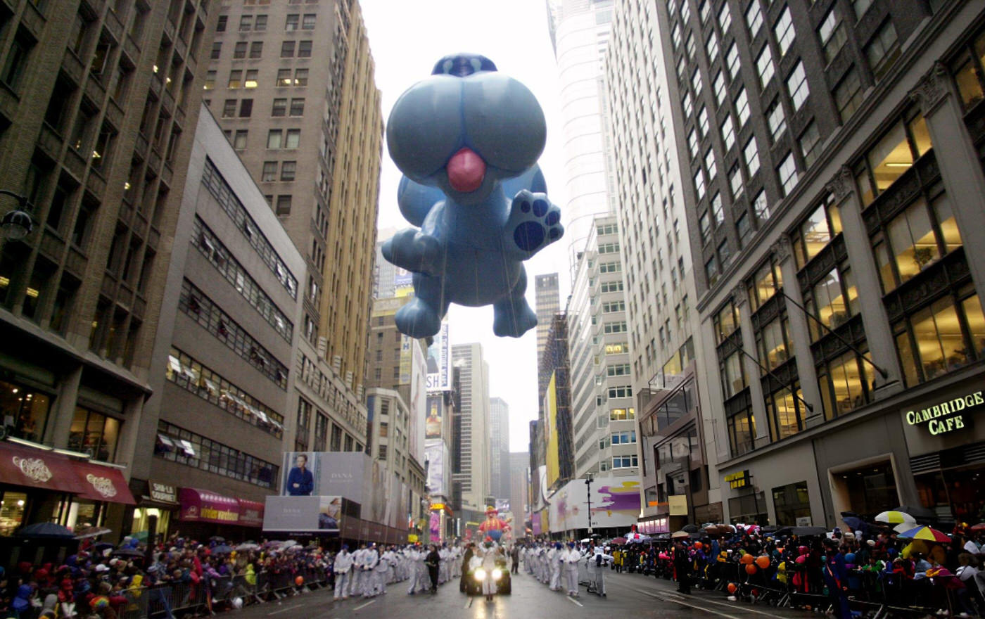 Big Blue Rides High Above The Marchers In The 73Rd Annual Macy'S Thanksgiving Day Parade.