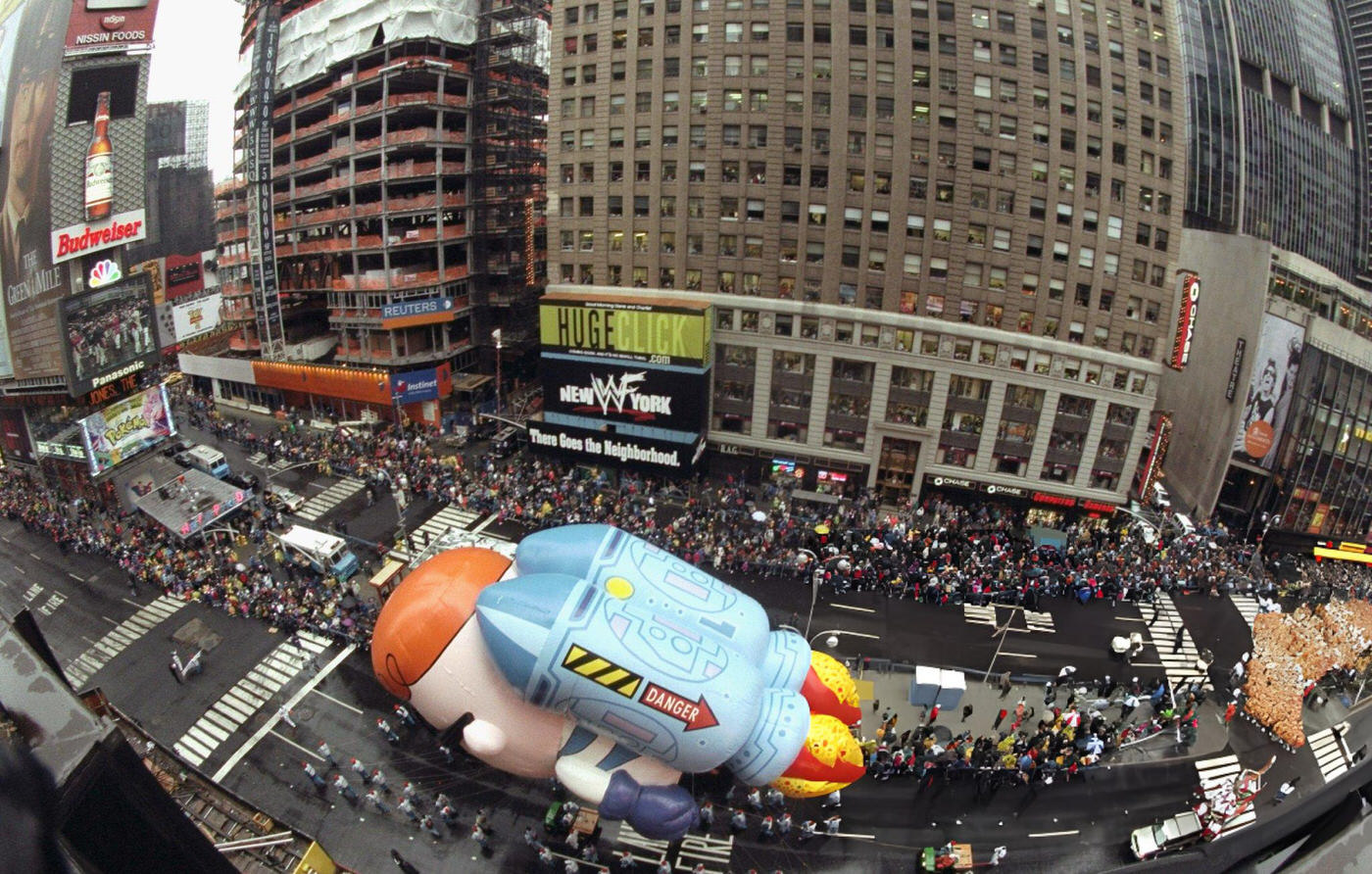 The Dexter Balloon Makes Its Way Through Times Square During The 73Rd Annual Macy'S Thanksgiving Day Parade.