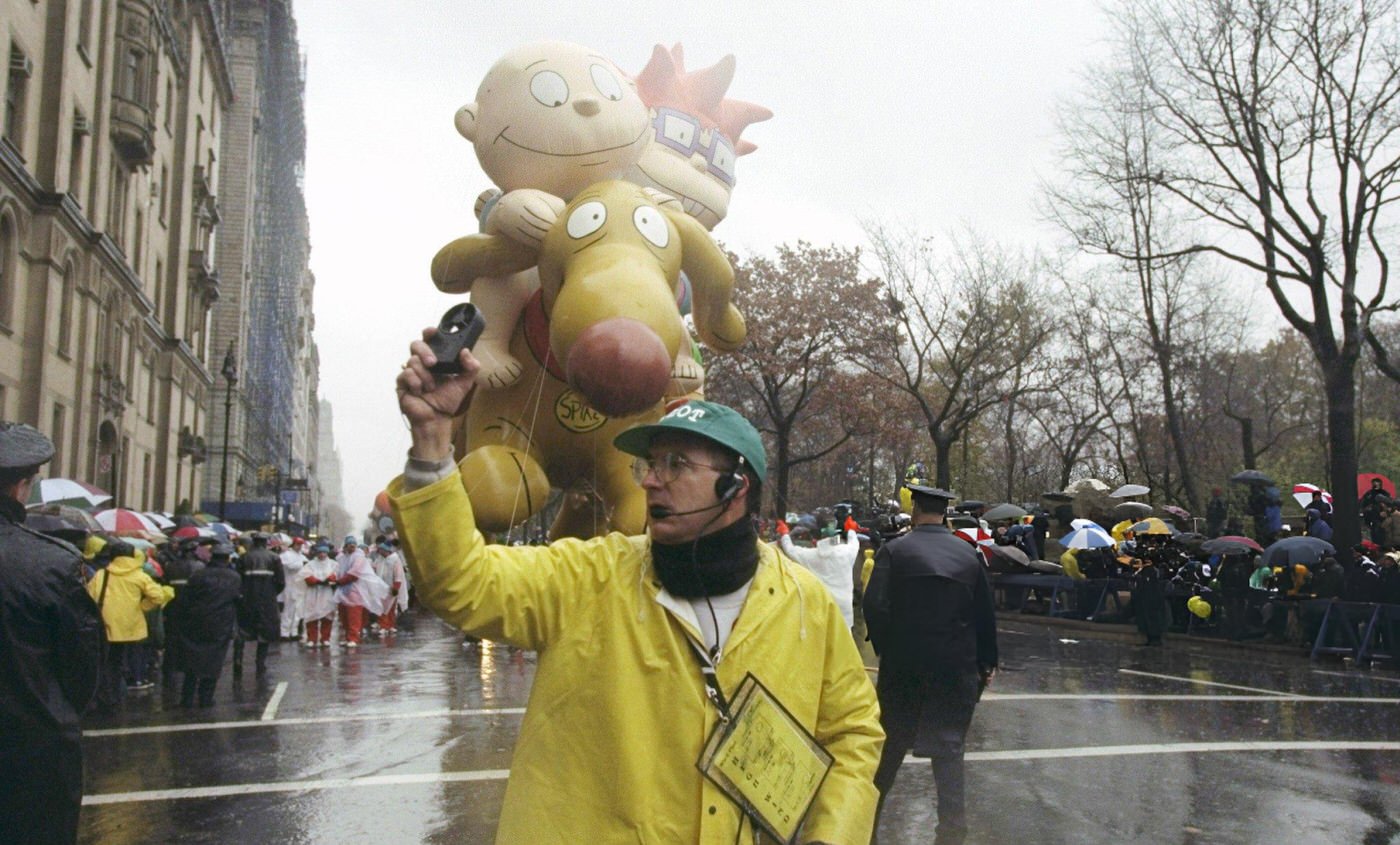 The Balloon Captain Uses A Wind Gauge As The Rugrats Balloon Follows During The 72Nd Annual Macy'S Thanksgiving Day Parade.