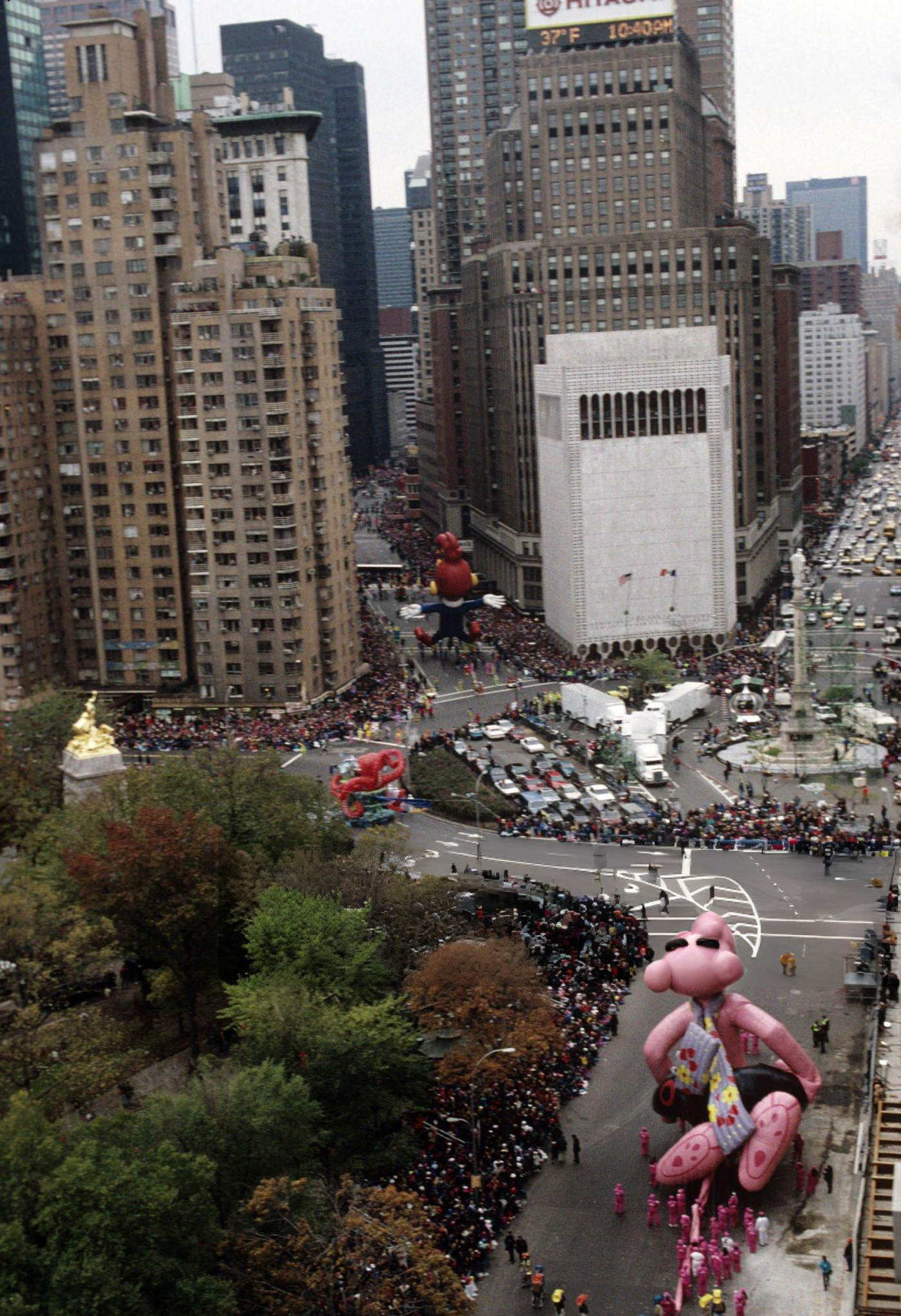 Scenic View Of Balloons Floating Down Central Park West Through Columbus Circle During The Macy'S Thanksgiving Day Parade, November 23, 1995.
