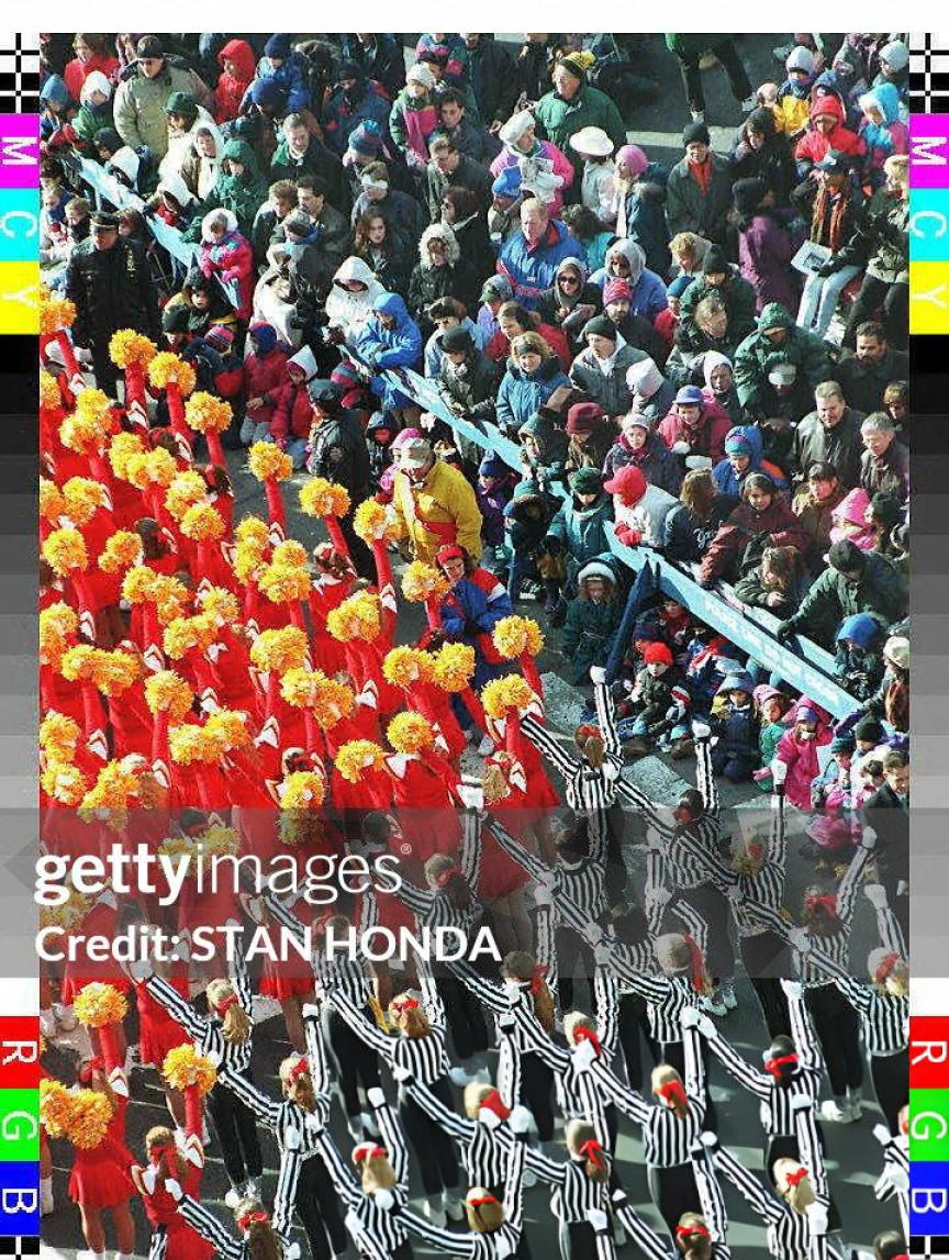 Marchers From The Universal Cheer And Dance Association Pass By The Crowd In Times Square During The Macy'S Thanksgiving Day Parade.