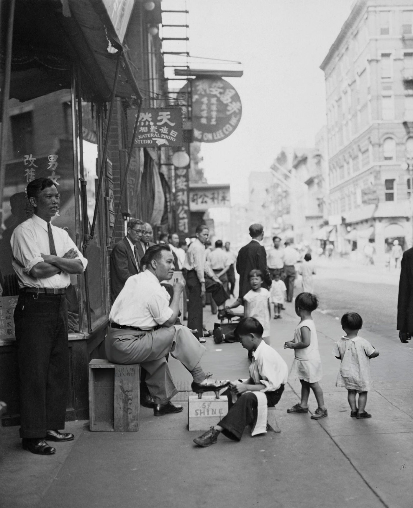 A Shoeshine Boy Working On Mott Street In Chinatown, Lower Manhattan, New York City, September 22, 1935.