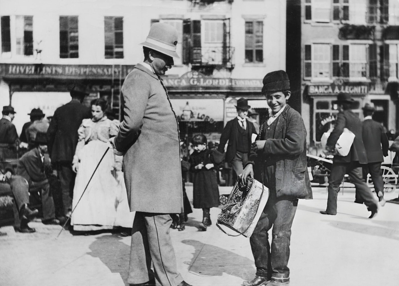 A Young Shoeshine Boy With A Policeman On Mulberry Street In Lower Manhattan, New York City