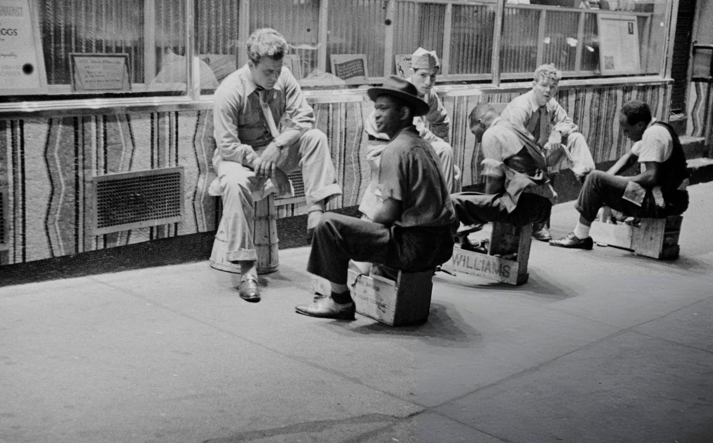Nighttime View Of Customers Having Their Shoes Cleaned By Shoeshine Boys On A Street Off Broadway Near Times Square In Midtown Manhattan, New York City, July 5, 1946.