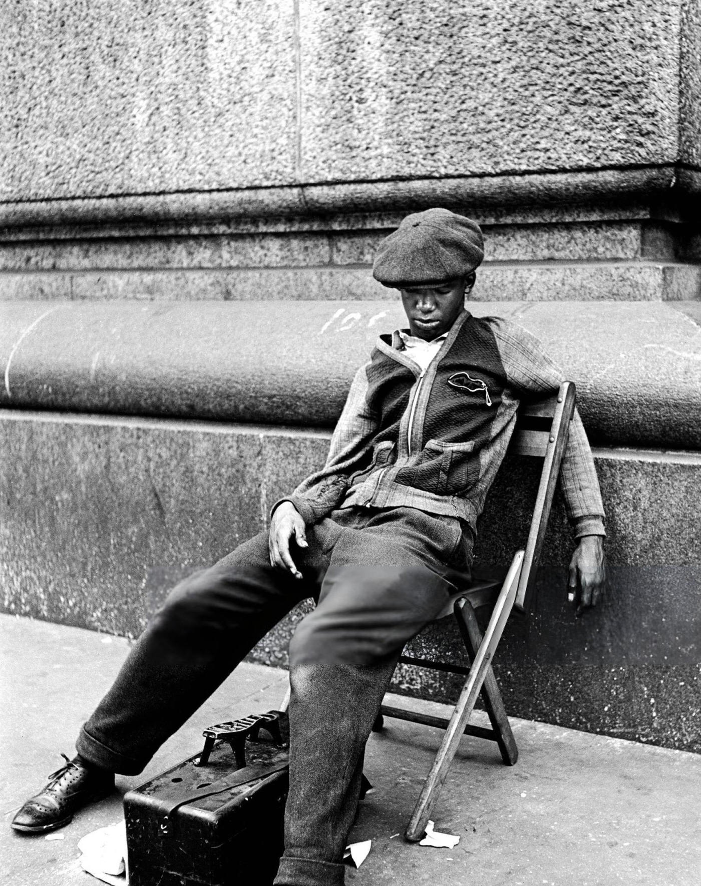 A Shoeshine Sits On His Chair And Sleeps, New York, 1948.