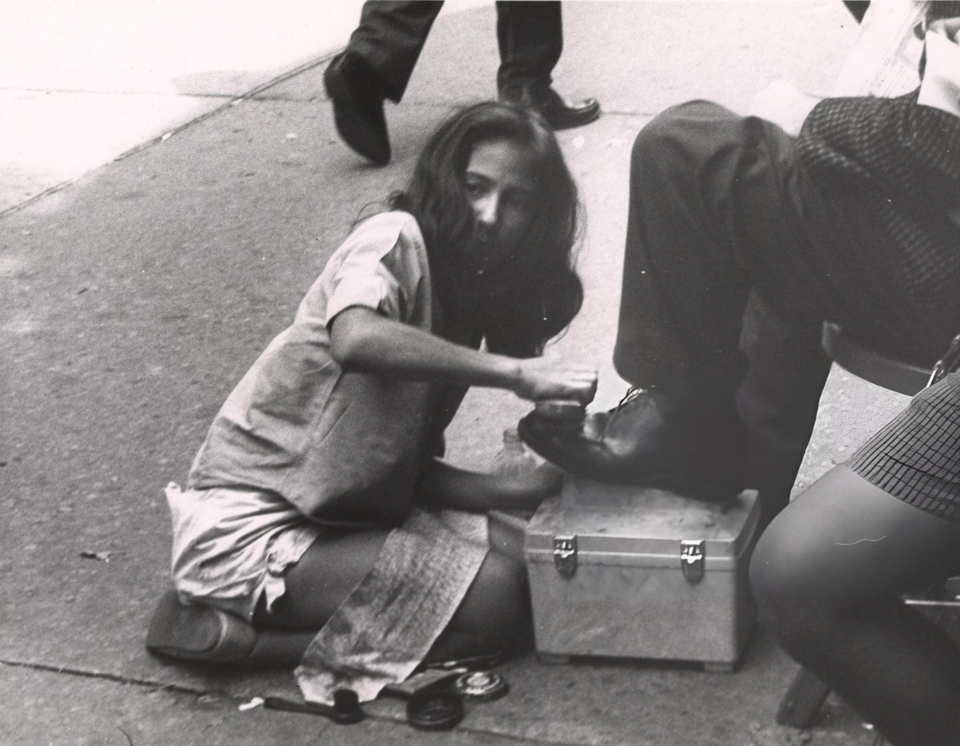 A Shoe Shine Girl Shining A Man'S Shoes On The Sidewalk, New York, Circa 1950S.