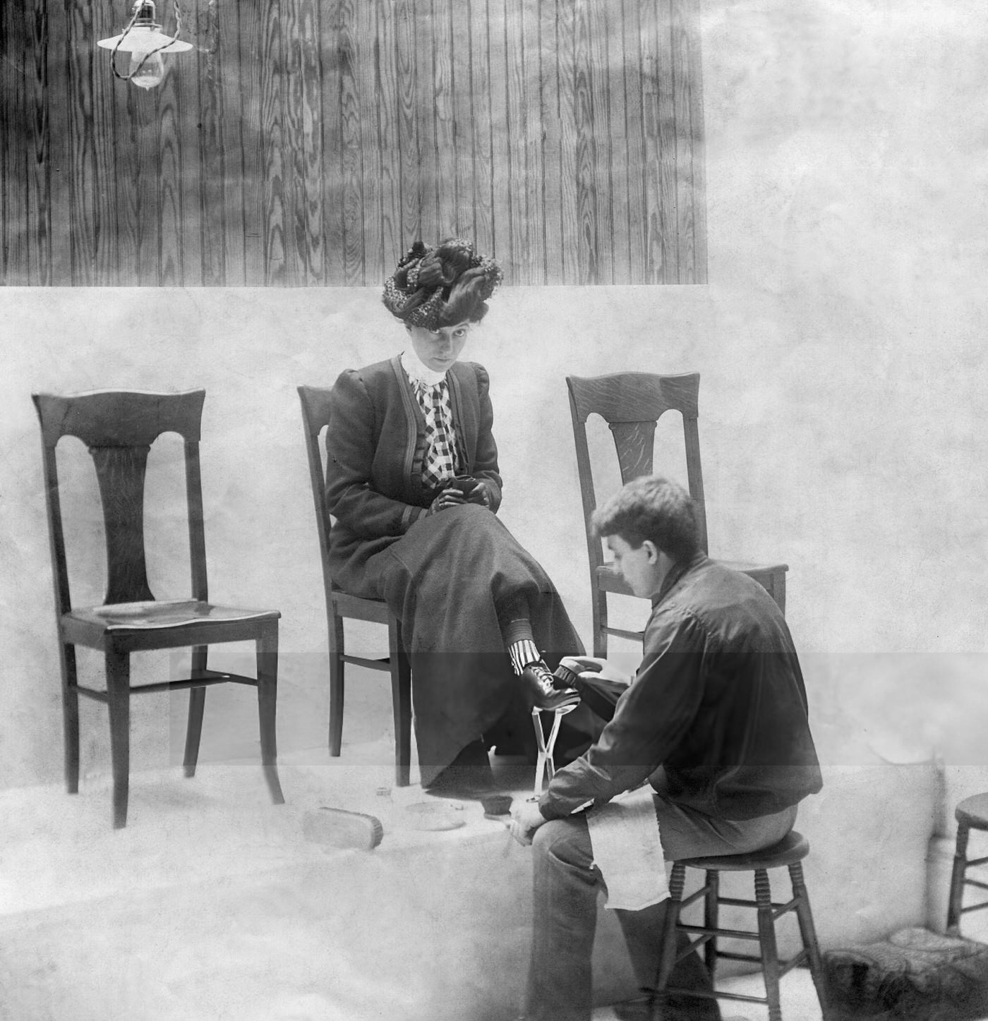 A Shoeshine Boy Serves A Lady In New York City, Circa 1906.
