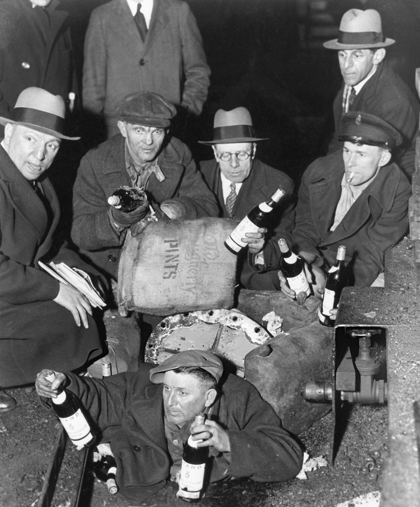 Prohibition Agents Examine Some Of The 3,000 Bags Of Liquor Hidden In A Coal Steamer In New York Harbor.