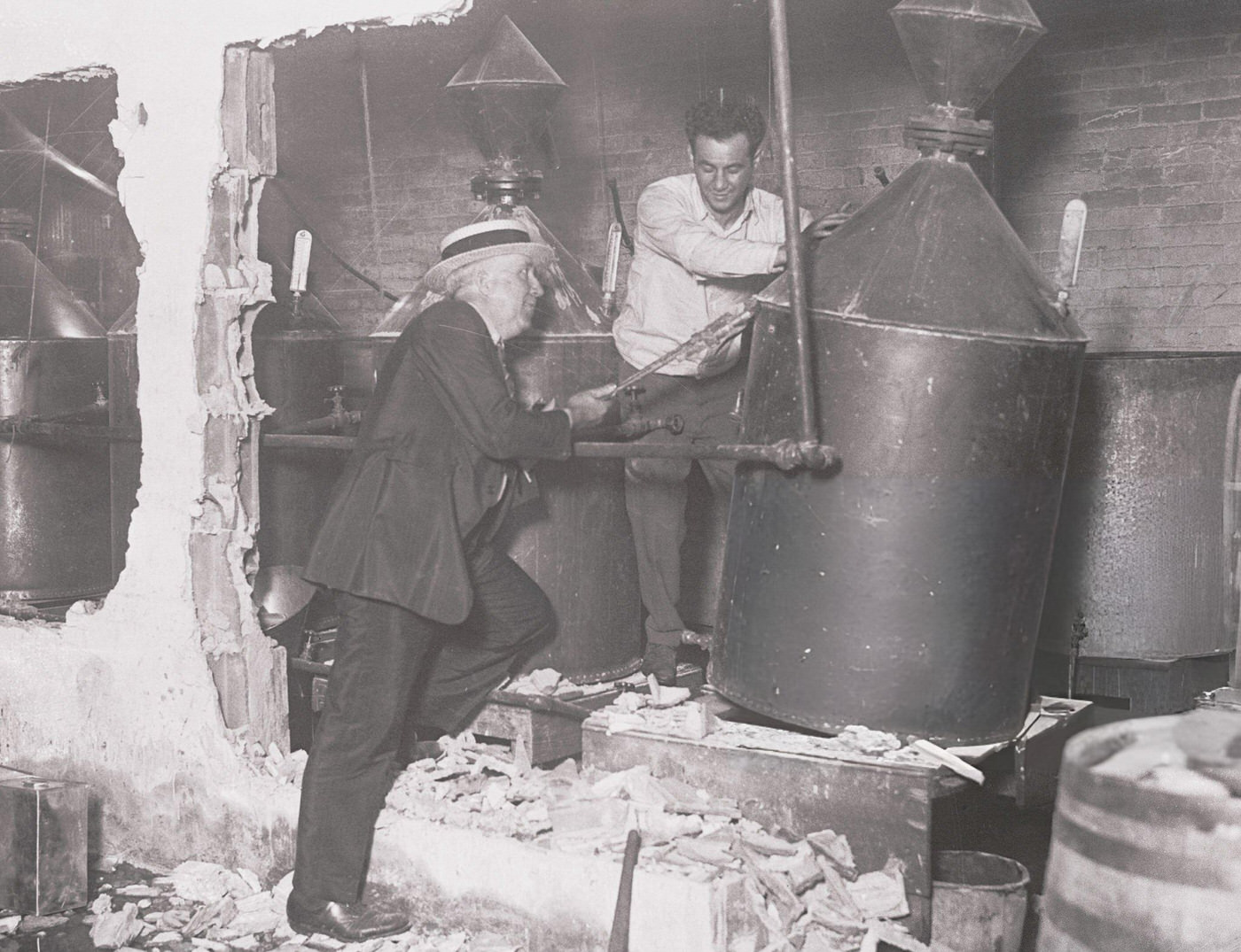 Revenue Agents At The Discovery Of An Illicit Still In A Garage At 142 Mulberry Street, New York City.