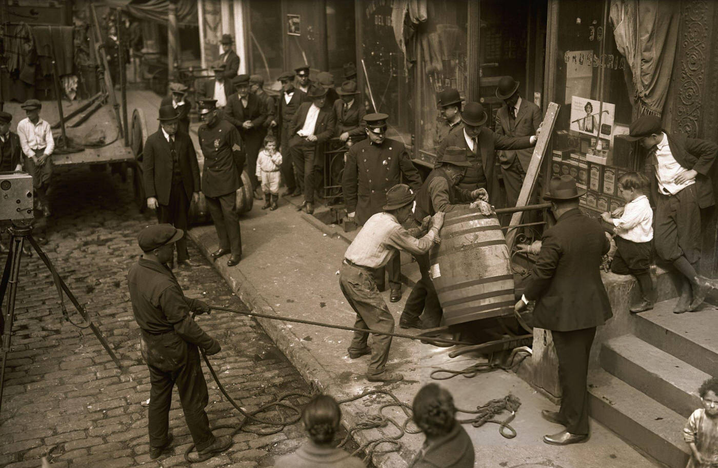 Police And Crowd Watching Men Remove Wine Barrel From 38 Cherry Street, 1921.