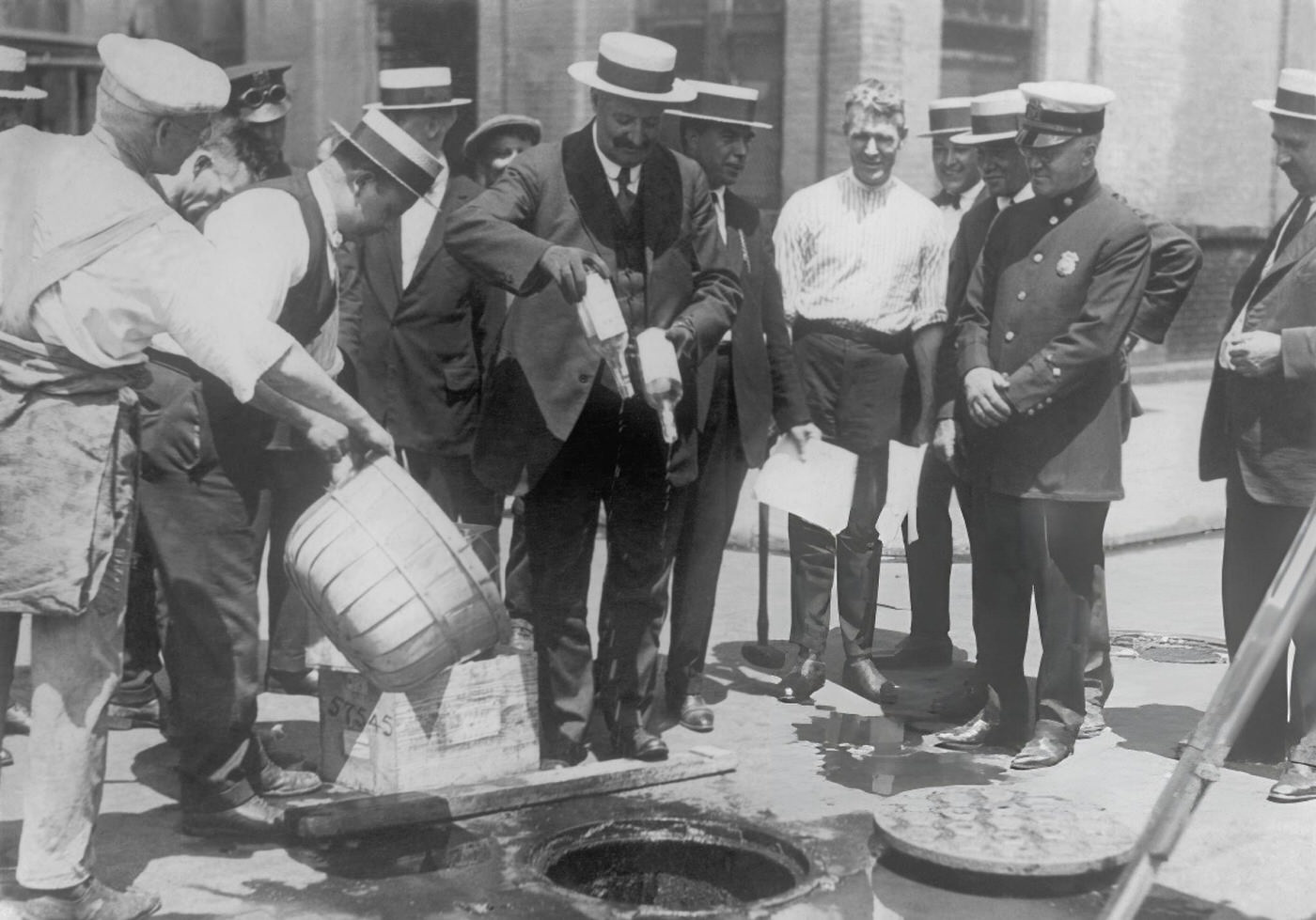 Adulterated Alcohol Seized By Police And Emptied Into Sewage Drains In New York, 1925-1930.