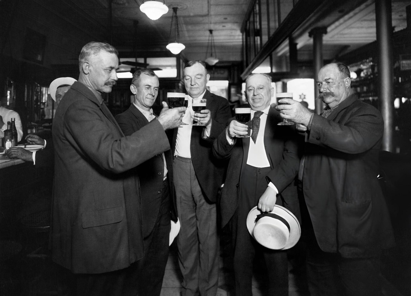 A Group Of Men Raise A Glass To Their Last Drink Before Prohibition Comes Into Force In New York City, 1920.