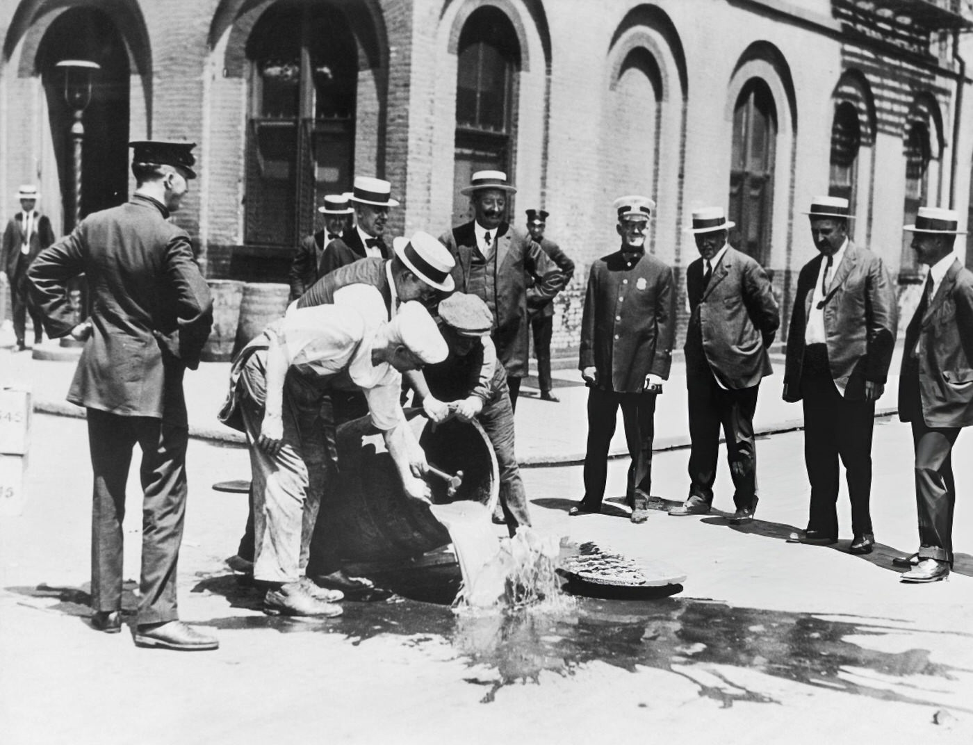 Alcohol Is Poured Away Into A New York Sewer During The Prohibition Era, 1920S.